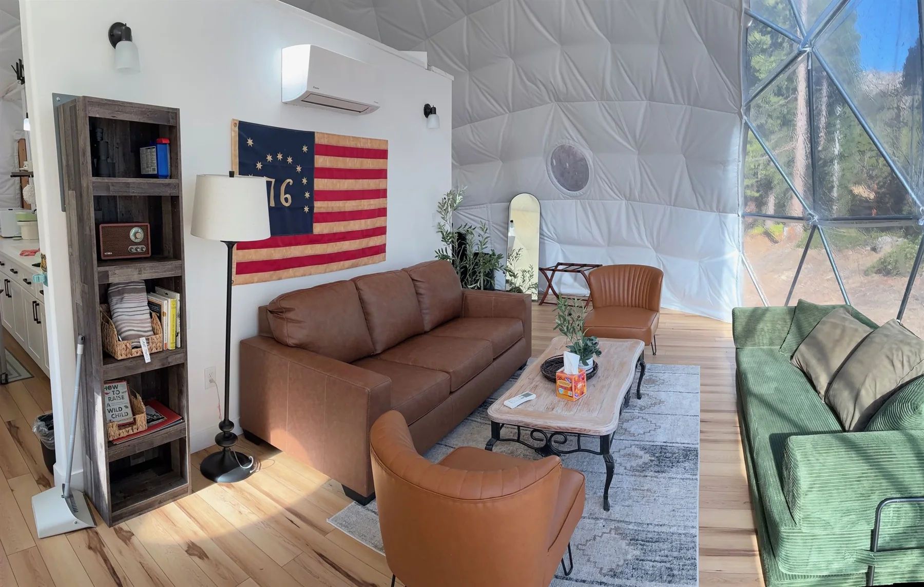 Dome seating area with sofa, chairs, and coffee table