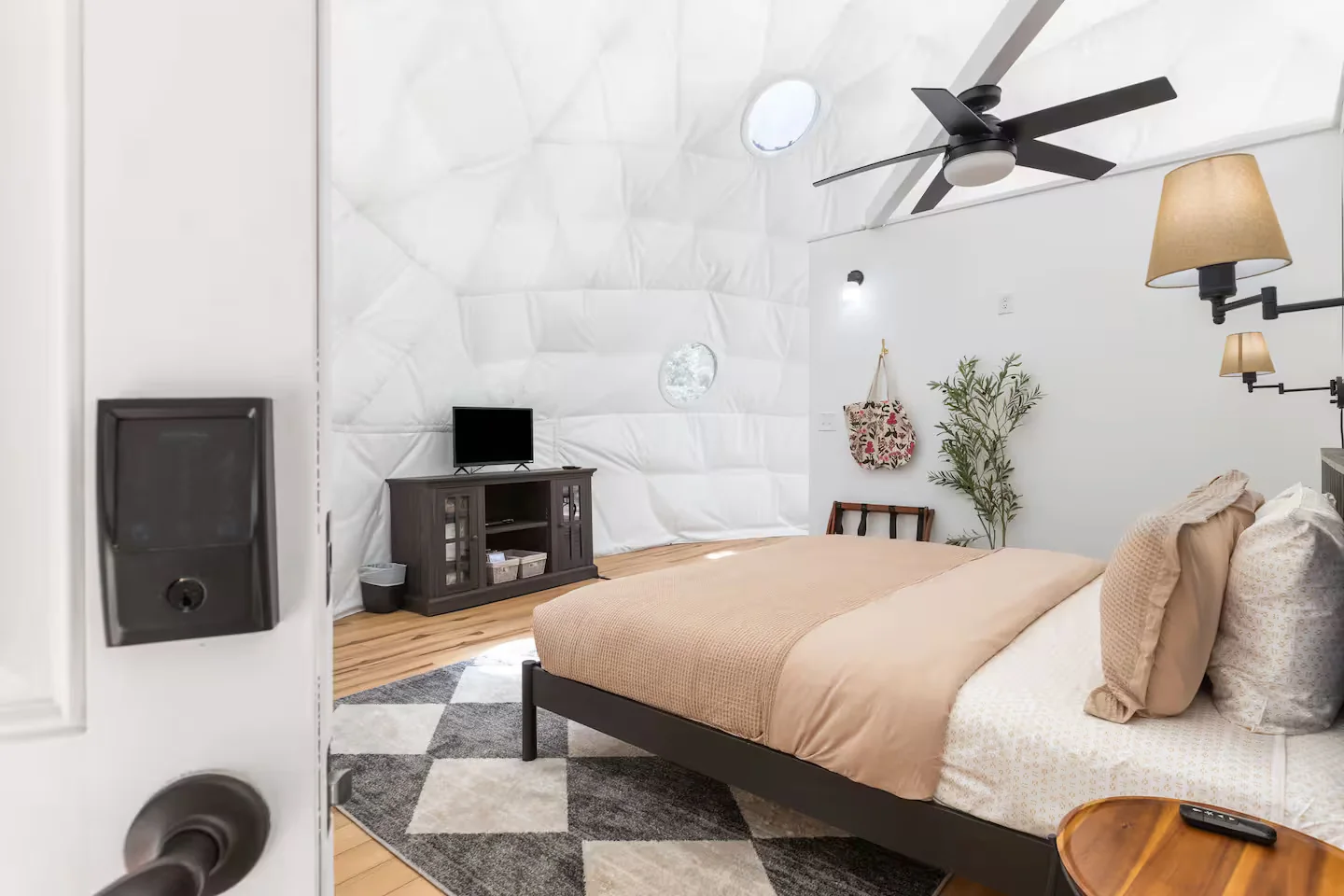 King bed and TV area inside the dome