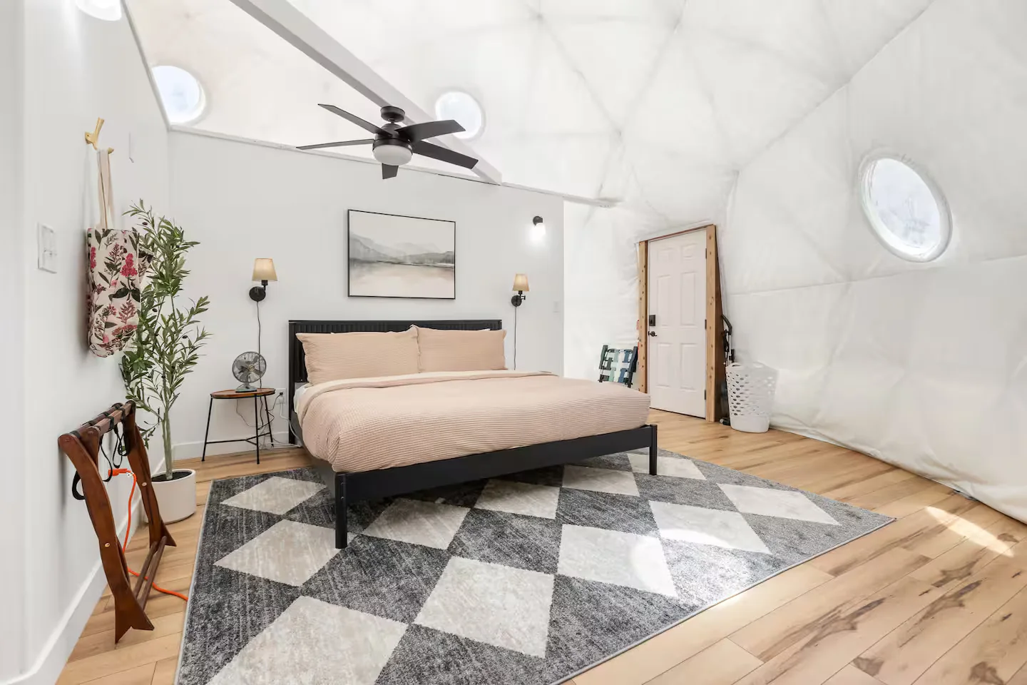 King bed with rug and curved dome walls